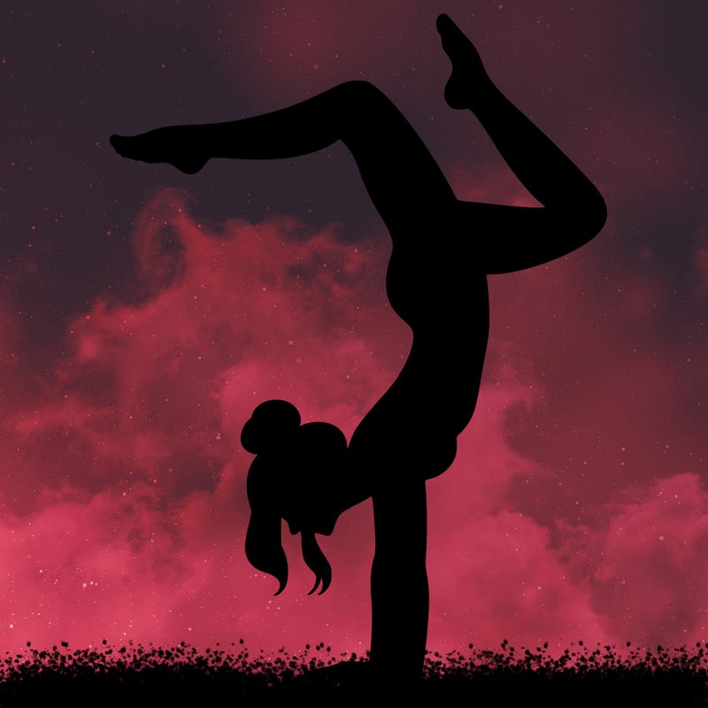 a woman doing a handstand