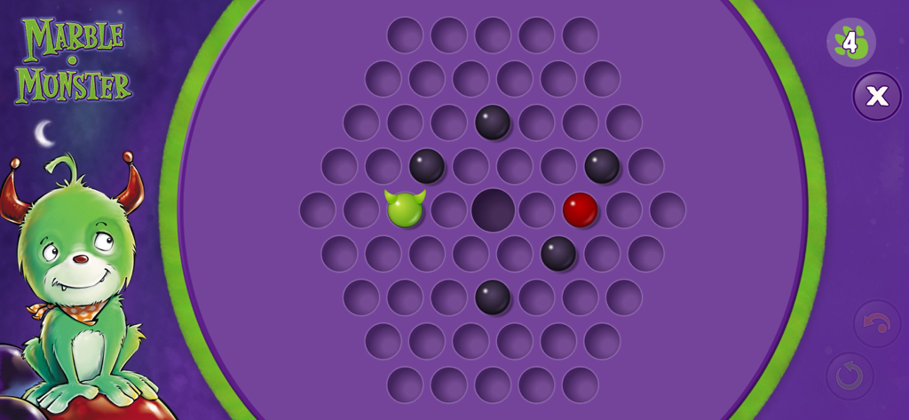 Marble Monster - Marble Monster game screen showing a hexagonal puzzle board with marbles and a green monster character.