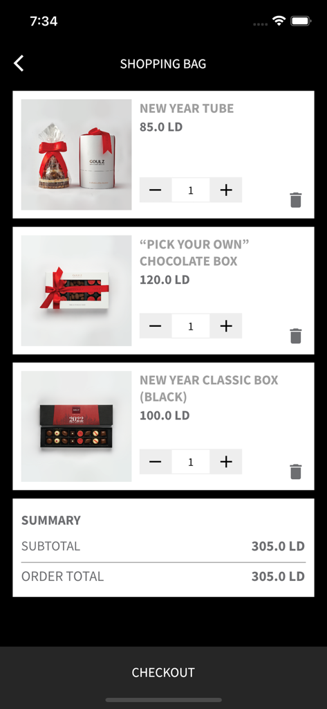Shopping bag screen in the GOULZ app showing luxury chocolate gift sets and order summary