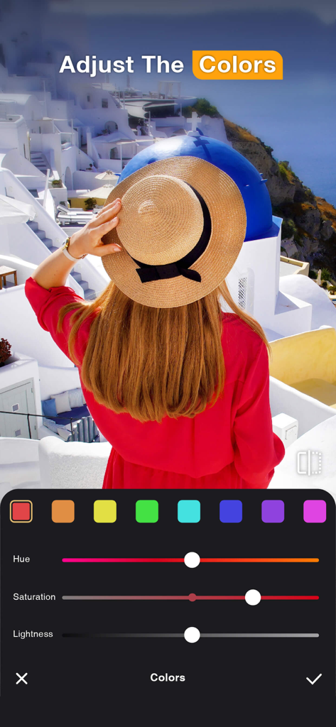 Une interface de retouche photo montrant les curseurs de teinte, de saturation et de luminosité sur une photo d'une femme à Santorin