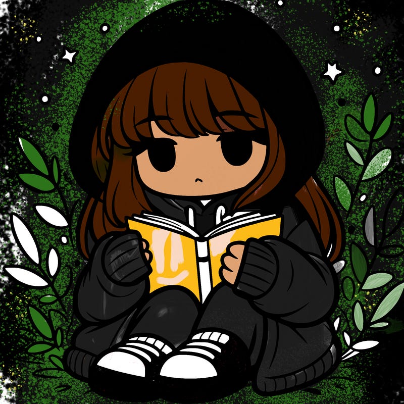 girl in oversized hoodie reading a book