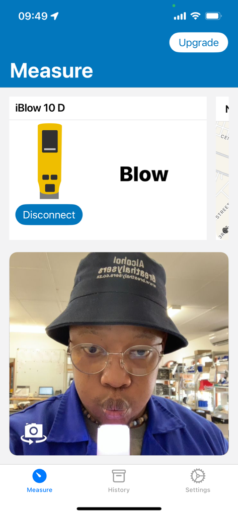 iSober - The iSober app interface showing a user taking a breath alcohol test with photo verification