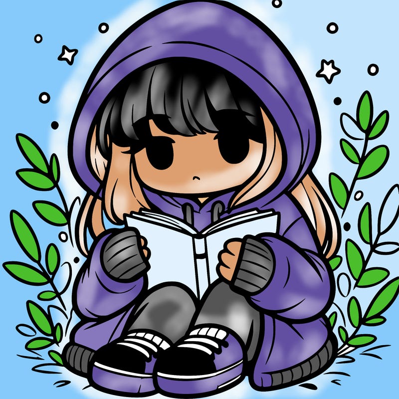girl in oversized hoodie reading a book