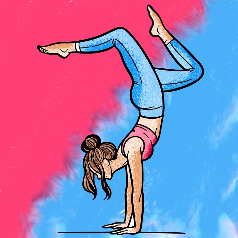 a woman doing a handstand