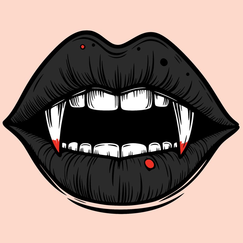 lips with vampire teeth