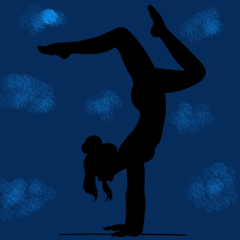 a woman doing a handstand