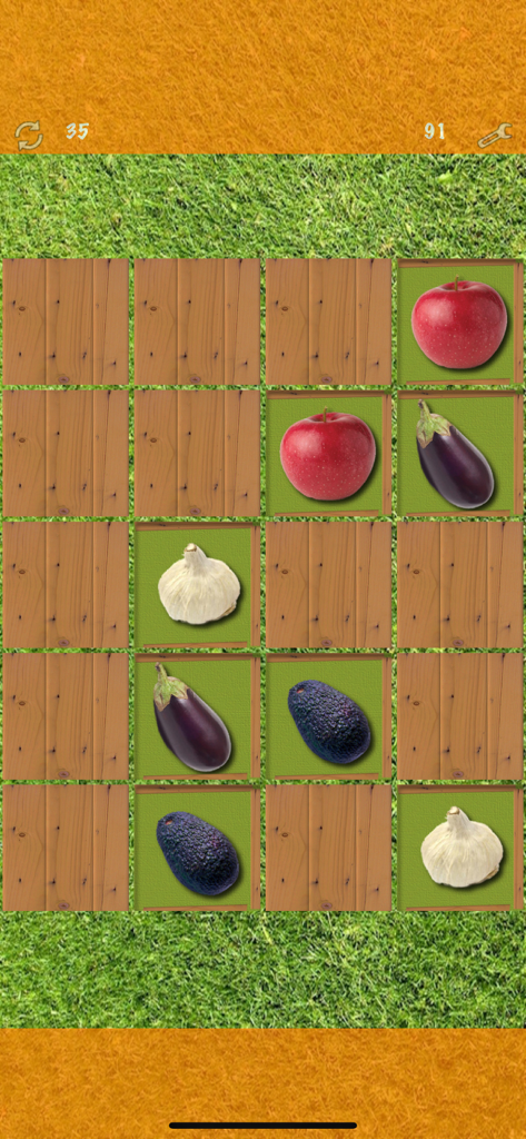 Pairs (Oh no! Another one!) - Gameplay screenshot of Pairs memory game showing flipped cards with apple eggplant garlic and avocado icons on a grass background