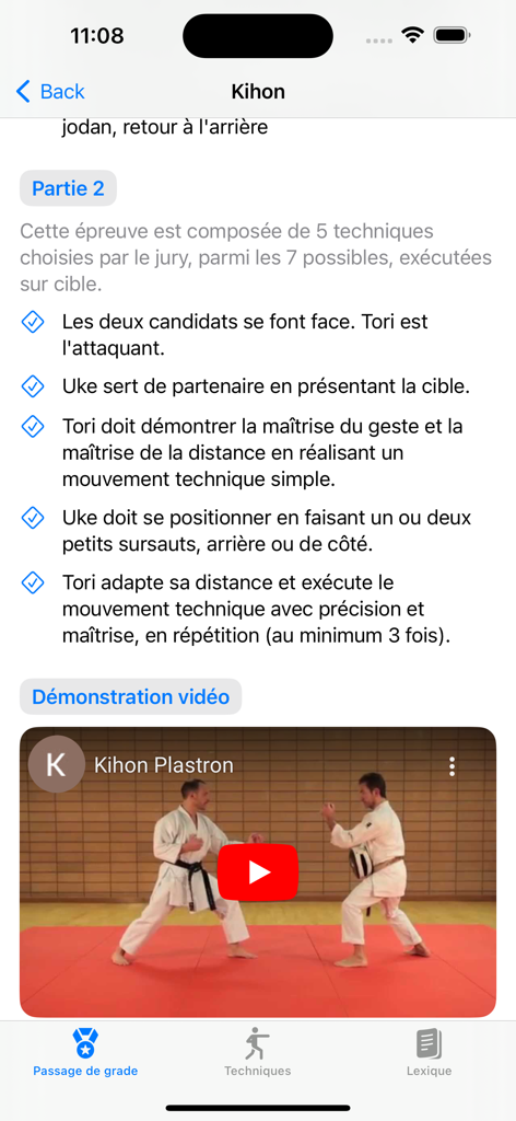karate - A screen from the karate app showing Kihon instructions and a video demonstration of two practitioners.