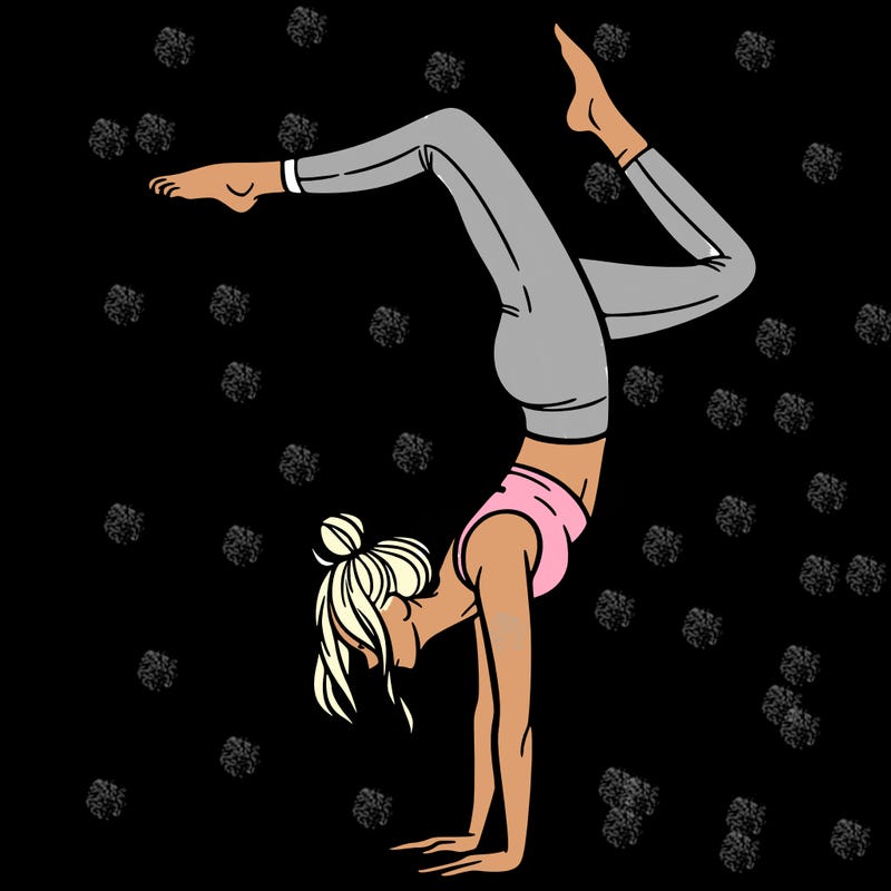 a woman doing a handstand