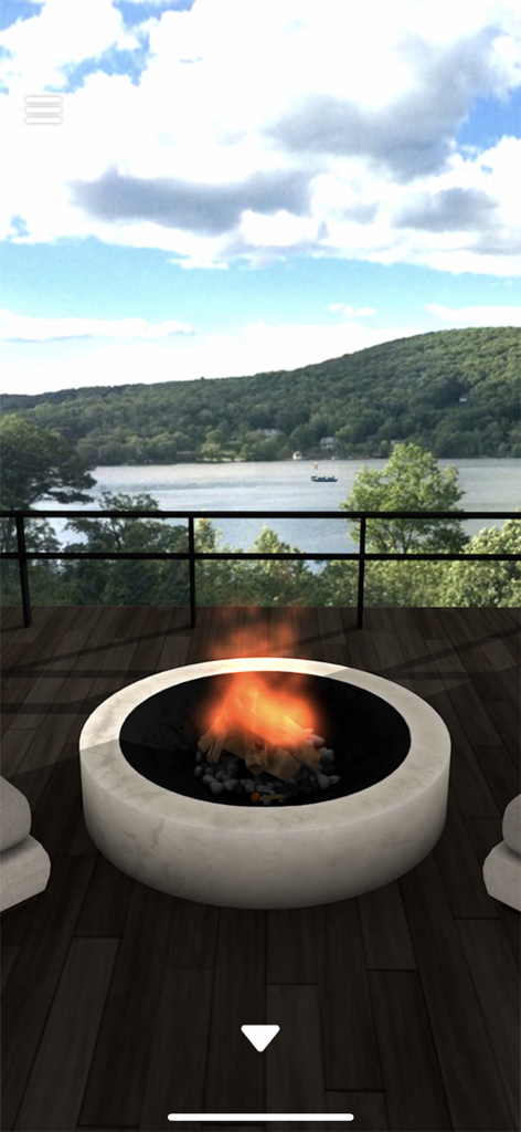 Escape Game: The Lake View - A luxury hotel terrace with a modern fire pit overlooking a serene lake and green hills