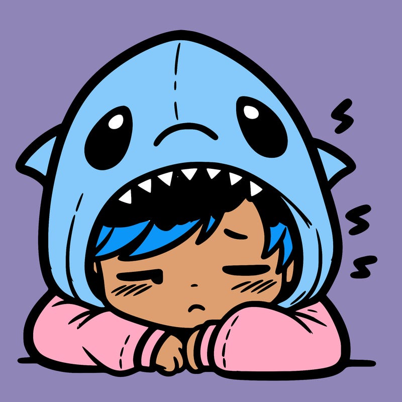 tired boy in shark hoodie