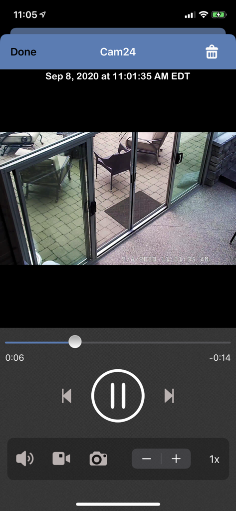 Blue Iris mobile app interface showing a security camera video playback of a patio with playback controls and a timestamp.