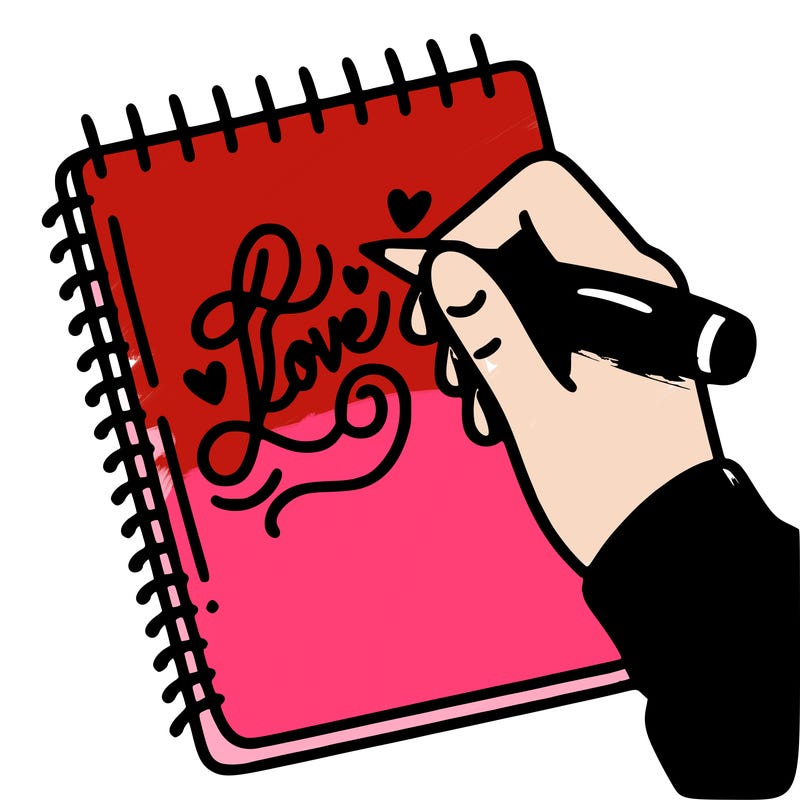 a hand writing “love” in calligraphy on a notebook