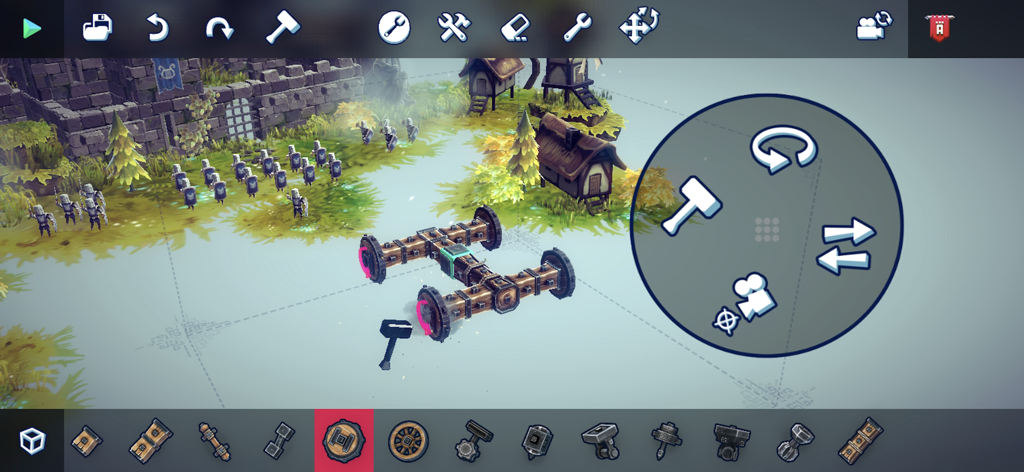 Besiege Mobile gameplay showing the building mode with a wooden vehicle chassis and touch-optimized UI