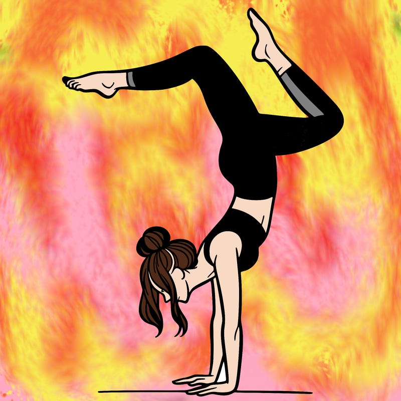 a woman doing a handstand