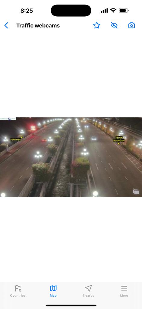 A live traffic camera feed showing a multi-lane road at night with Sentosa and Telok Blangah location labels
