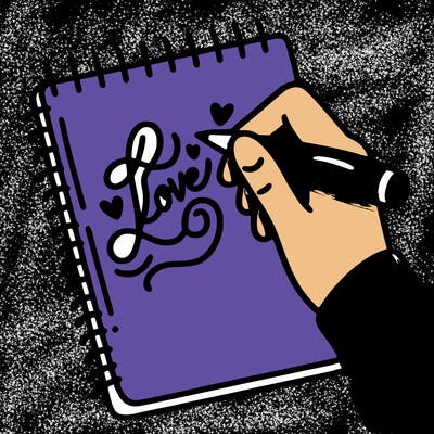 a hand writing “love” in calligraphy on a notebook
