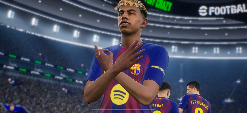 Soccer player in Barcelona kit celebrating in eFootball mobile game stadium