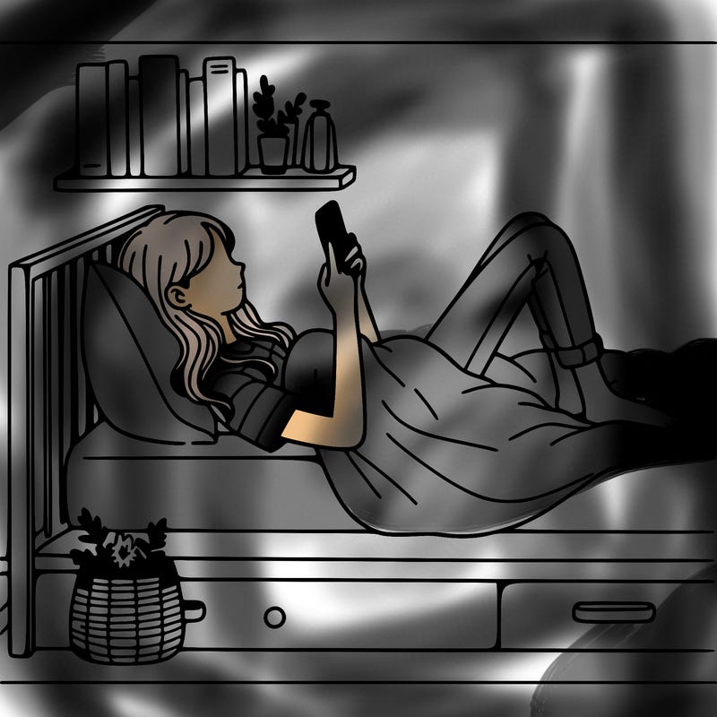 a girl laying on her bed with her phone