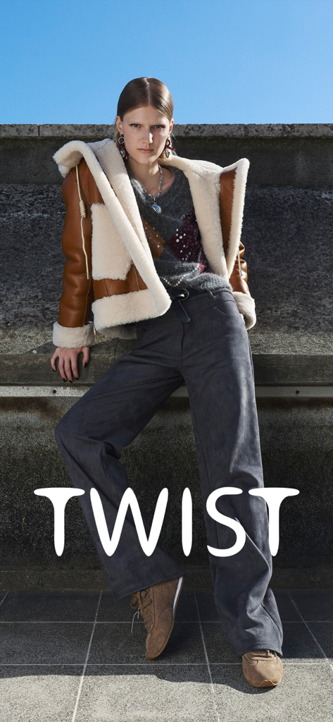 Twist - A female model posing in an edgy shearling jacket and sequined sweater for the Twist fashion app.