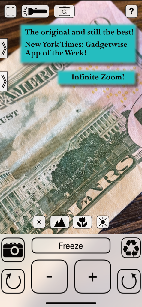 Interfaz de la aplicación Lupa mostrando un zoom de alta magnificación en un billete de dólar para revelar detalles finos