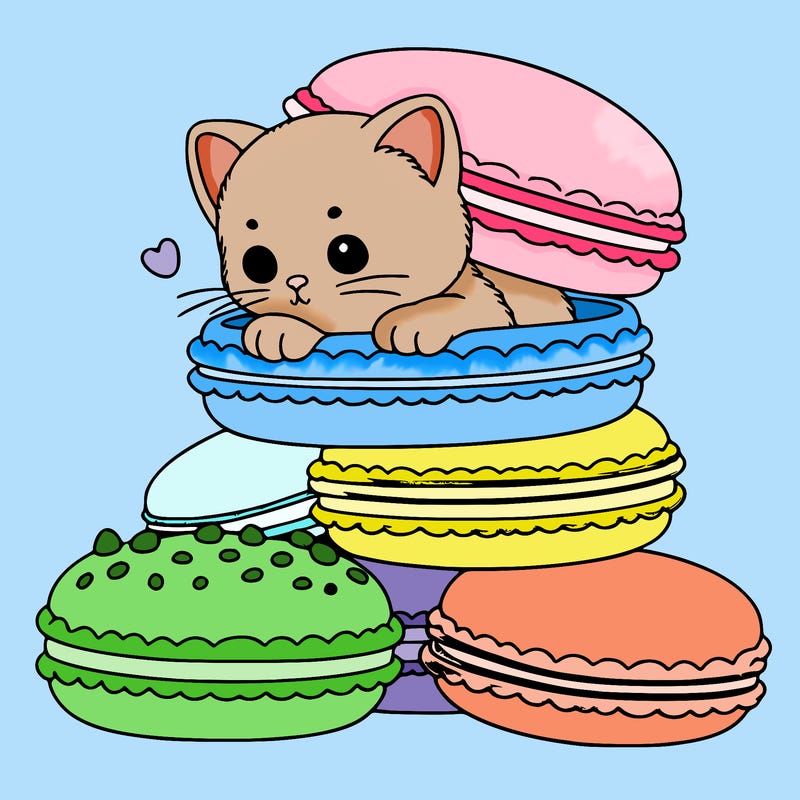 a kitten popping out of a stack of pastel macarons