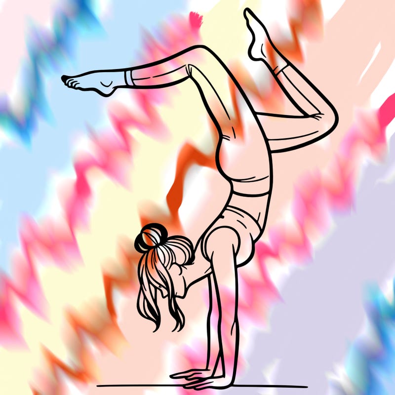 a woman doing a handstand