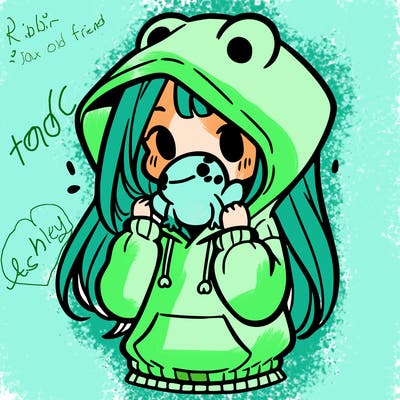 a girl holding a froggy hoodie