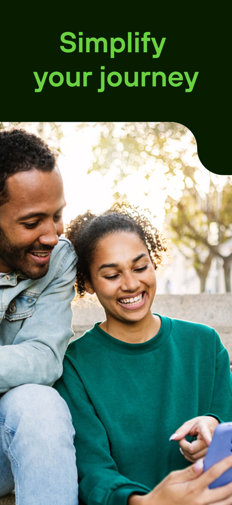 A happy couple using a smartphone together in an urban setting with the text Simplify your journey
