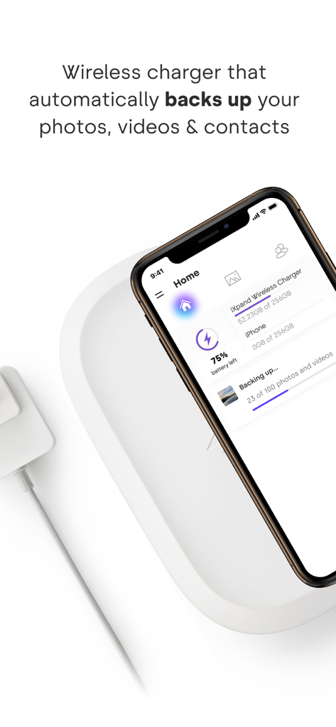iPhone on a wireless charging pad showing automatic photo and video backup progress