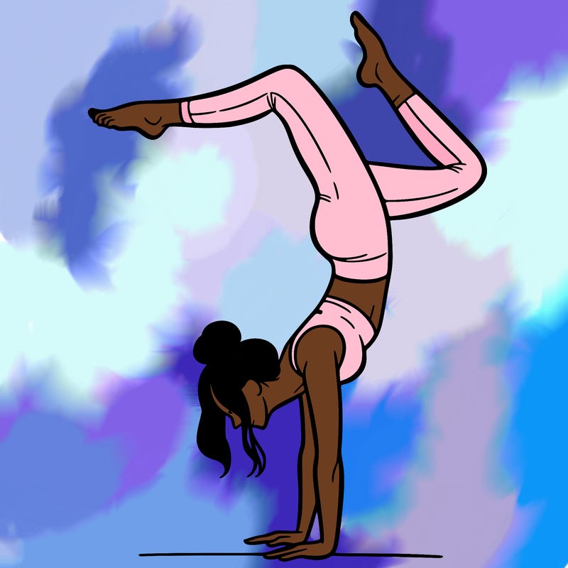 a woman doing a handstand