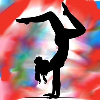 a woman doing a handstand