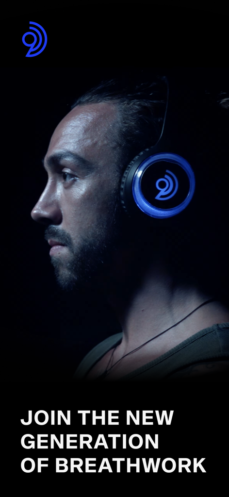 A man wearing glowing blue headphones for an immersive 9D Breathwork journey