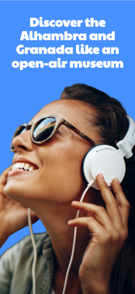 Alhambra Audioguide & Tours - Donna sorridente con cuffie che esplora l'Alhambra e Granada utilizzando una guida audio immersiva