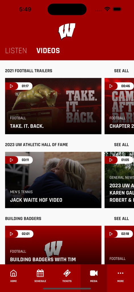 The media section of the Wisconsin Badgers app displaying video categories like football trailers and Hall of Fame interviews.