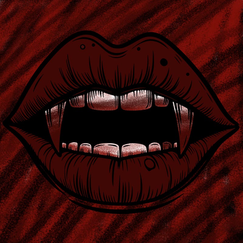 lips with vampire teeth