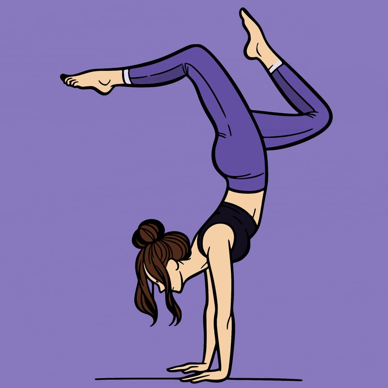 a woman doing a handstand