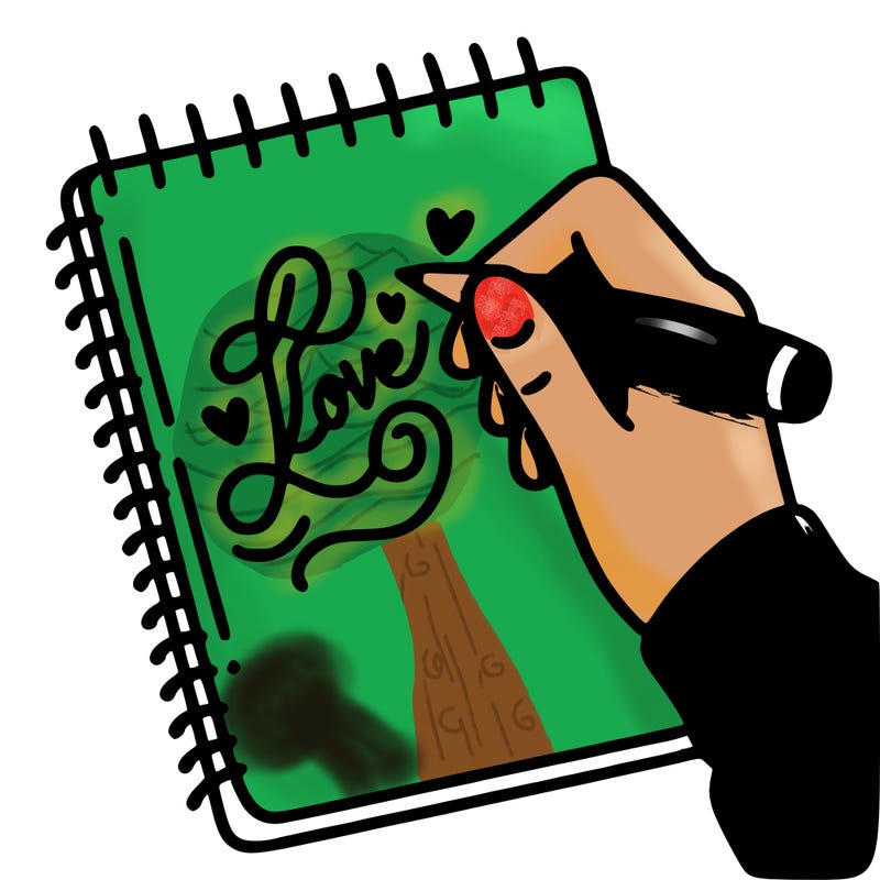 a hand writing “love” in calligraphy on a notebook