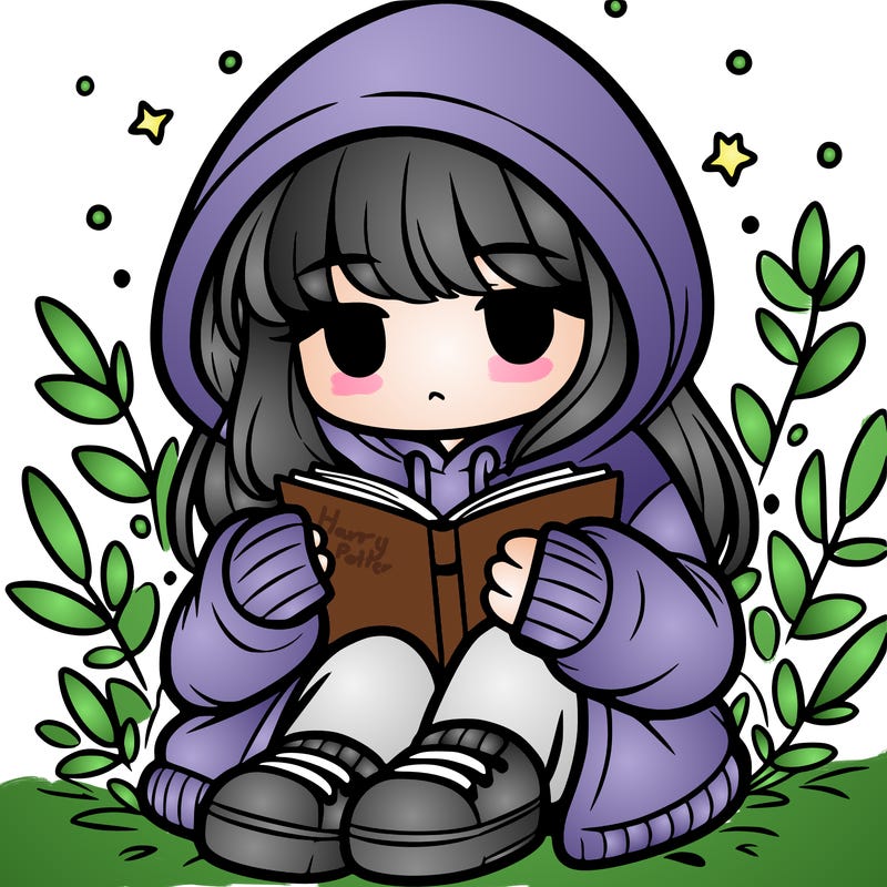 girl in oversized hoodie reading a book