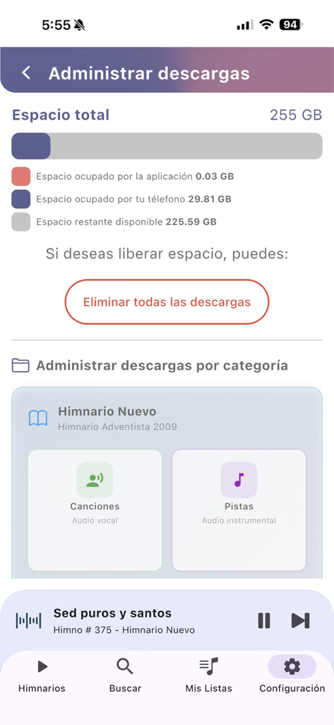 Himnario Adventista Completo - Interface of the Himnario Adventista Completo app showing storage management and download options for vocal and instrumental hymns.