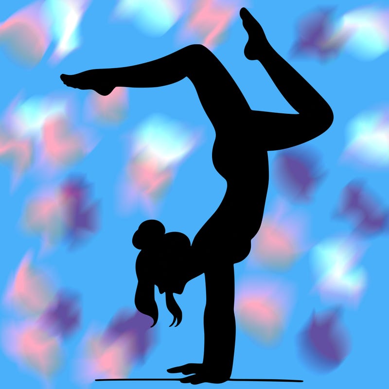 a woman doing a handstand