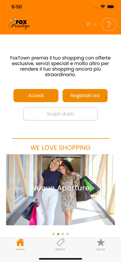 FoxPrivilege - The home screen of the FoxPrivilege app for FoxTown Factory Stores featuring login and registration buttons and a shopping promotion banner.