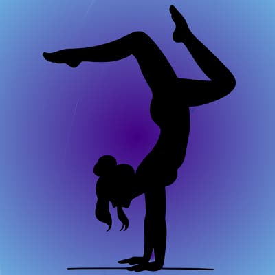 a woman doing a handstand