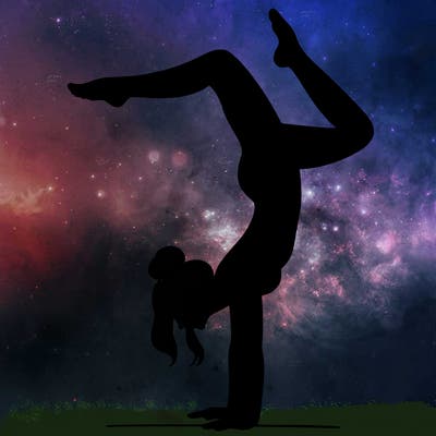 a woman doing a handstand