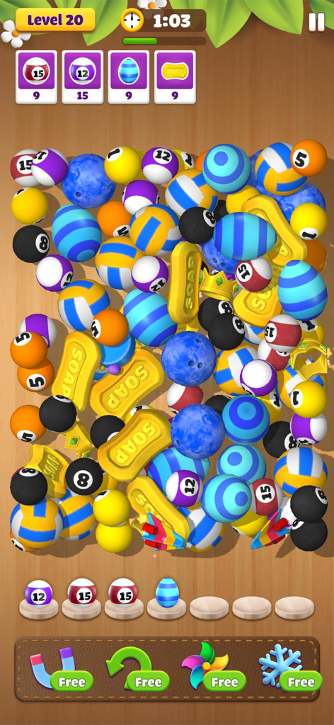 Dream Family: Triple Match 3D - Gameplay screen of Dream Family Triple Match 3D showing various 3D objects like balls and soap to match in a puzzle level