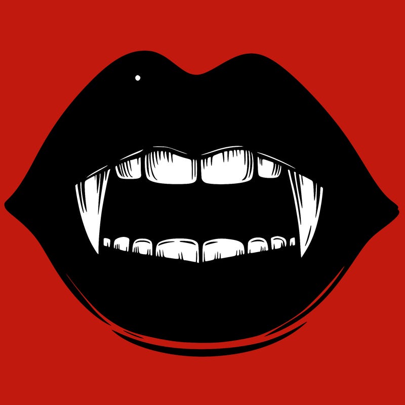 lips with vampire teeth