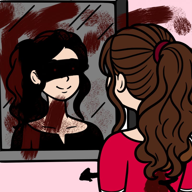 a woman looks at her reflection in the mirror