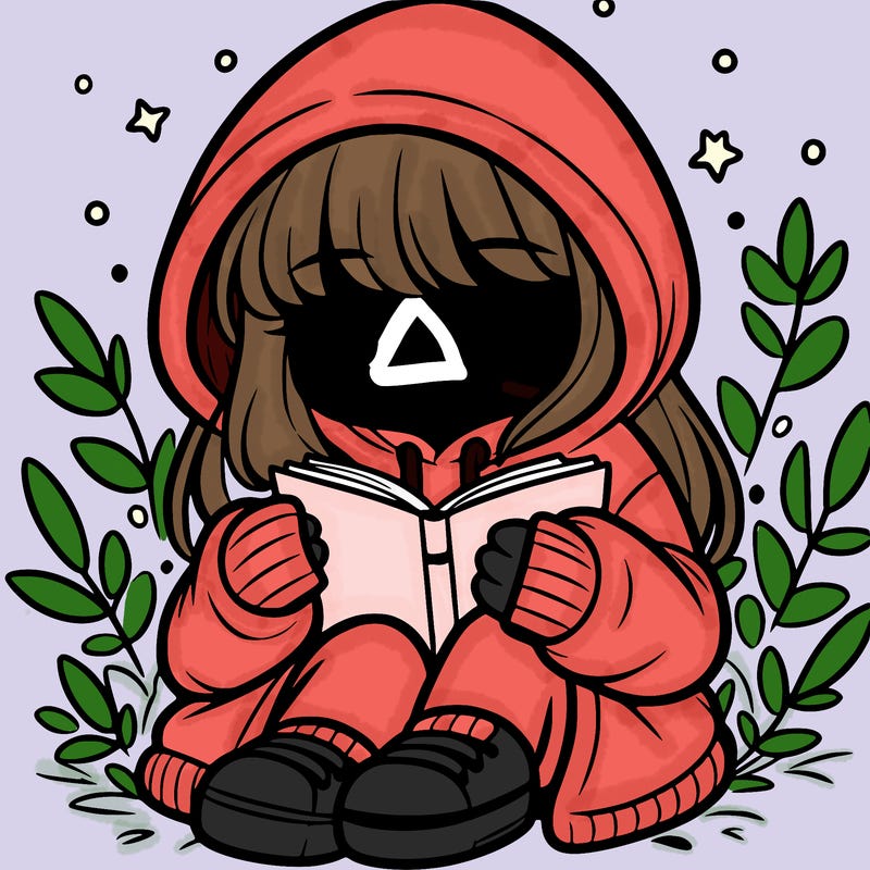 girl in oversized hoodie reading a book