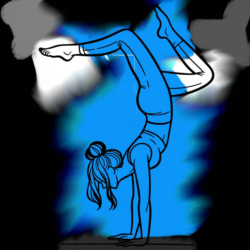 a woman doing a handstand