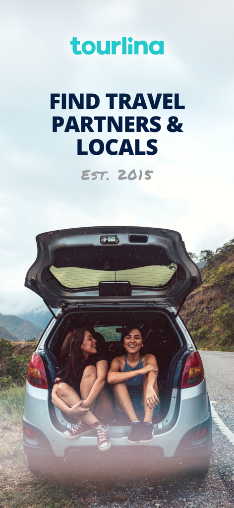 Tourlina - Travel Buddy - Two female travelers sitting in the trunk of a car on a scenic mountain road.